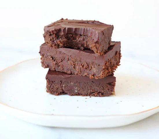 Stack of super fudgy black bean brownies made with Navitas Organics Cacao Powder