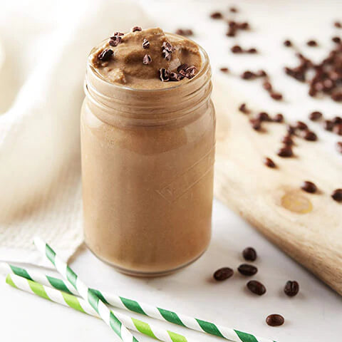 Cacao coffee smoothie in a glass jar made with Navitas Organics Cacao Powder