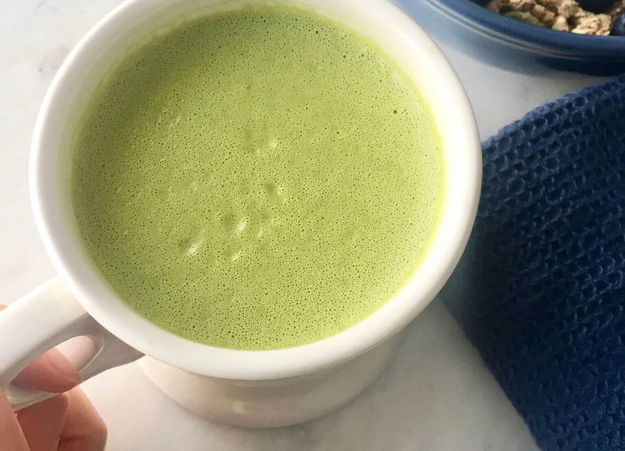 White mug of matcha latte made with Navitas Organics Matcha Powder