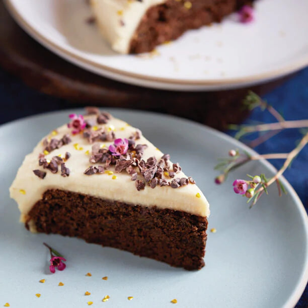 Vegan and gluten-free frosted chocolate cake made with Navitas Organics Cacao Powder