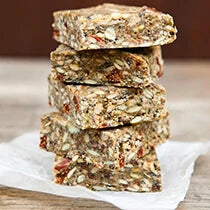 Stack of superfood seed bars made with Navitas Organics Goji Berries, Hemp Seeds and Cacao Nibs