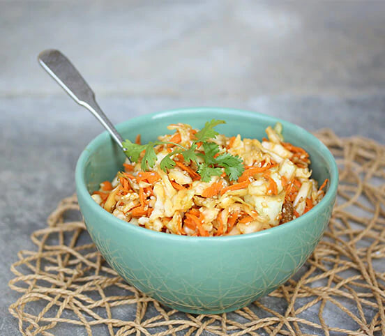 Serving bowl of sesame mulberry cole slaw