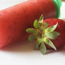 Strawberry chia popsicle and a fresh strawberry