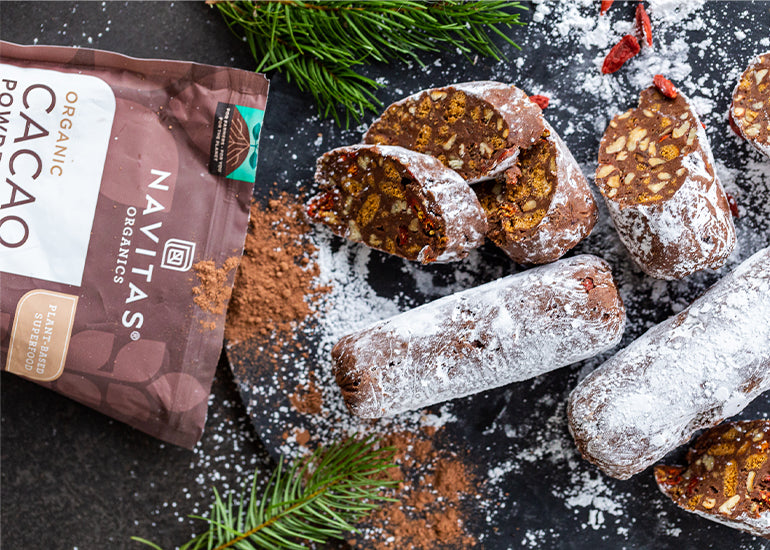 Chocolate logs made with Navitas Organics Cacao Powder, Chia Seeds and Goji Berries, dusted with powdered sugar