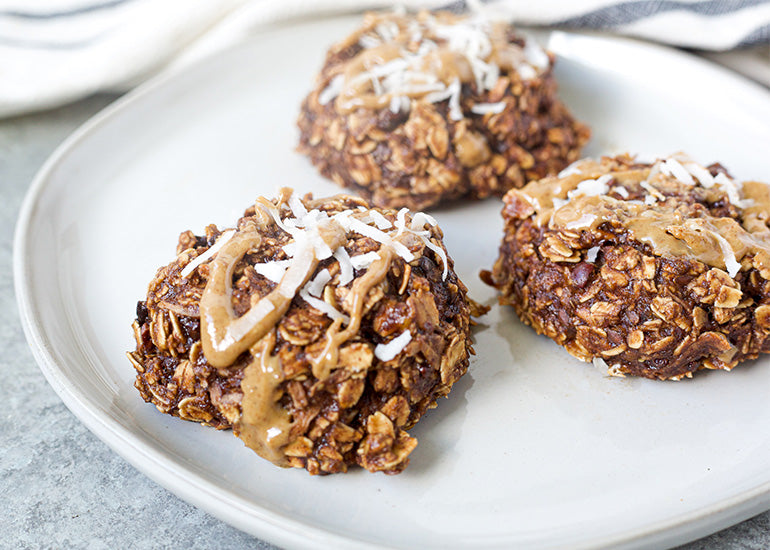 A plate of chocolate trail mix cookies made with Navitas Organics Cacao Powder and Cacao Sweet Nibs