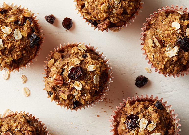 Rows of cranberry orange oatmeal muffins made with Navitas Organics Chia Powder and Hemp Seeds