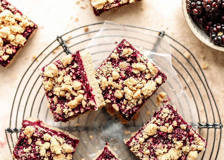 Berry crumble bars made with Navitas Organics Maqui Powder on a cooling rack