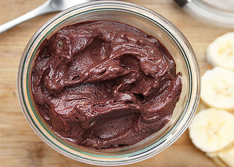 A dish filled with acai cherry gelato made with Navitas Organics Acai Powder.