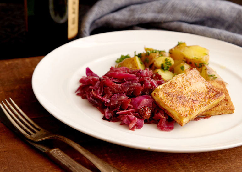 A plate of braised red cabbage with Navitas Organics Goldenberries, seared tofu and potatoes.