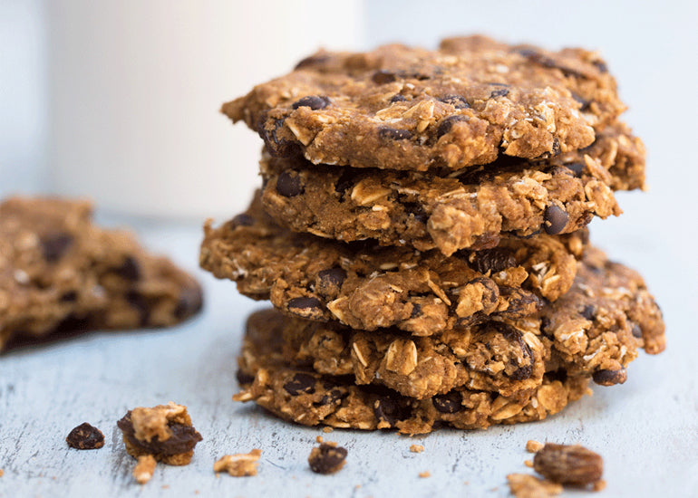 A stack of oatmeal chocolate chip cookies made with Navitas Organics Maca Powder.