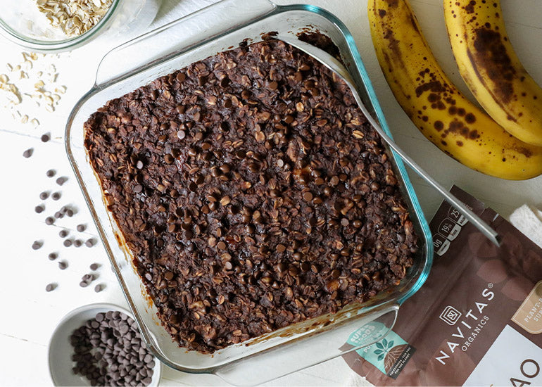 A pan of chocolate baked oatmeal made with Navitas Organics Cacao Powder.