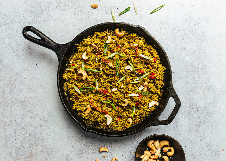 A pan of Turmeric Rice made with Navitas Organics Turmeric Powder.