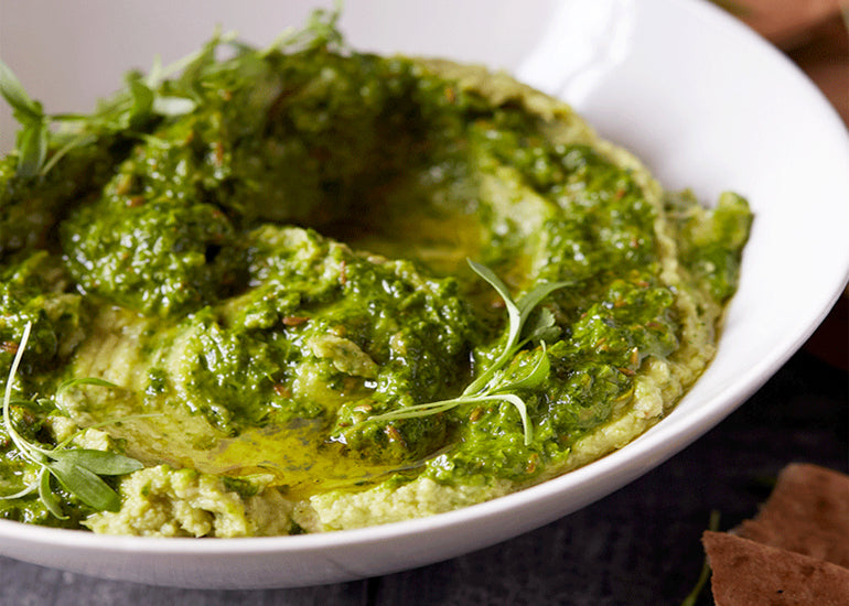 A bowl of hummus made with Navitas Organics Hemp Seeds.