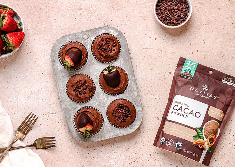 A pan of chocolate-covered strawberry cupcakes made with Navitas Organics Cacao Powder, Cacao Wafers, Chickpea Flour and Cacao Sweet Nibs
