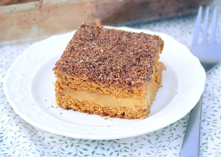 Slice of pumpkin coffee cake made with Navitas Organics Cacao Nibs