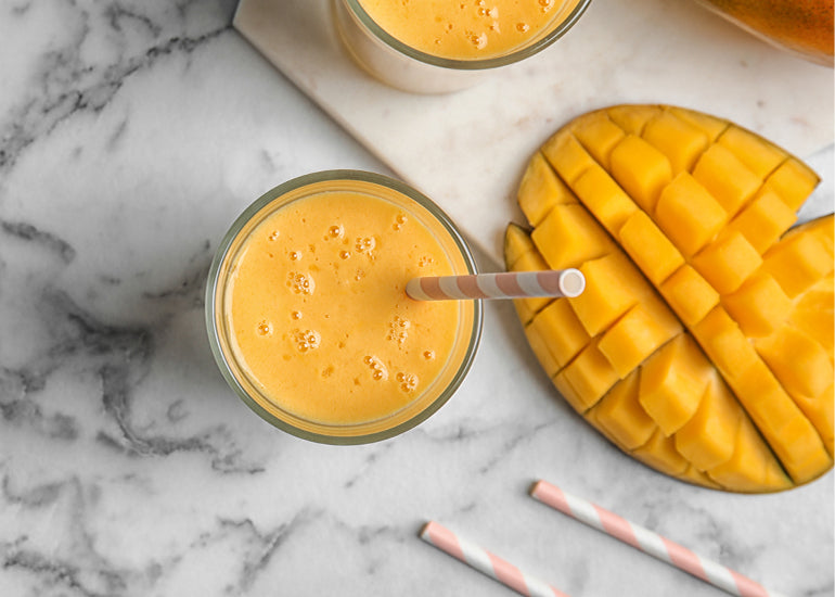 A creamy mango smoothie made with Navitas Organics Superfood+ Sea Veggie Blend