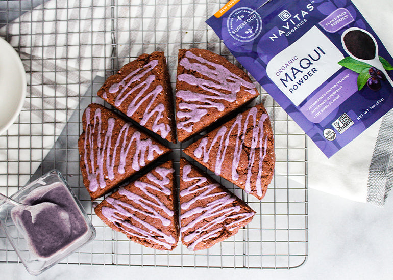 Gluten and dairy free scones made with Navitas Organics Cacao Powder and glazed with Maqui Powder