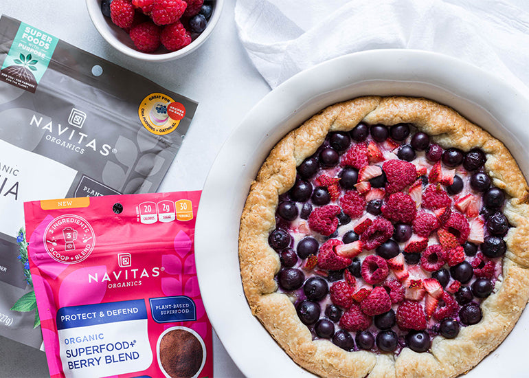 A honey ricotta berry galette made with Navitas Organics Superfood+ Berry Blend and Chia Seeds, topped with fresh berries.