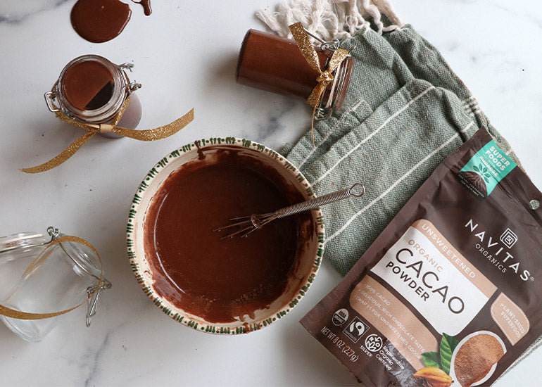 Festive holiday jars filled with a DIY cacao face mask made with Navitas Organics Cacao Powder
