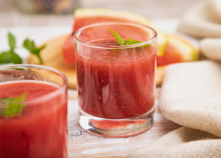 Glasses filled with a watermelon chia fresca drink made with Navitas Organics Chia Seeds, garnished with fresh mint