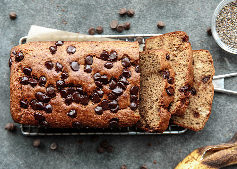 A sliced loaf of chocolate chip banana bread made with Navitas Organics Chia Seeds