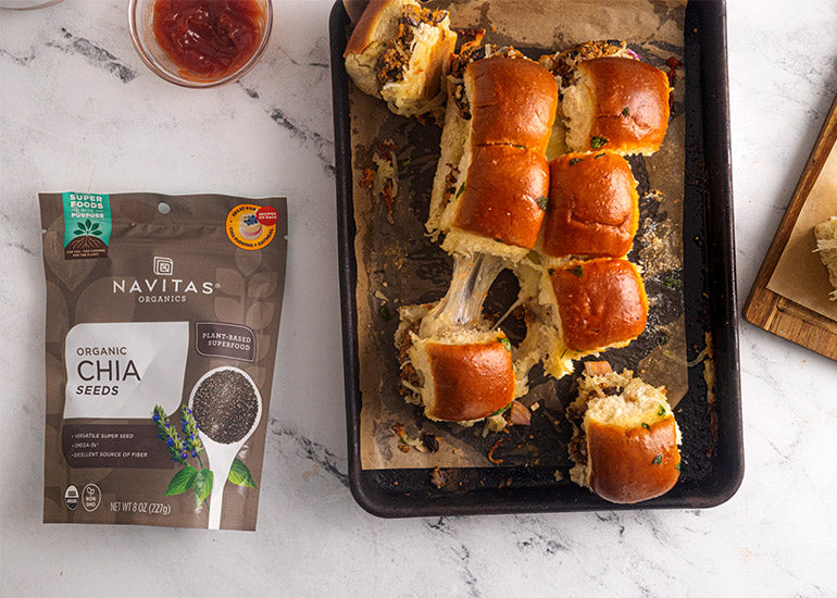 A pan topped with chia black bean sliders made with Navitas Organics Chia Seeds
