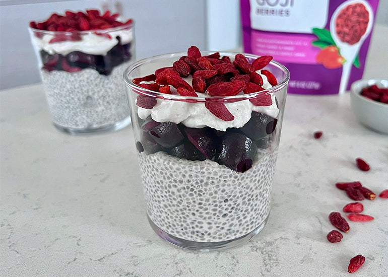 Two glasses filled with a layered goji berry chia parfait made with Navitas Organics Chia Seeds and Goji Berries