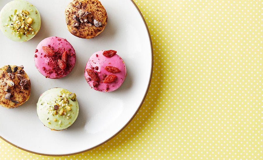 Macaroon cookies made with and topped with various Navitas Organics superfood ingredients.