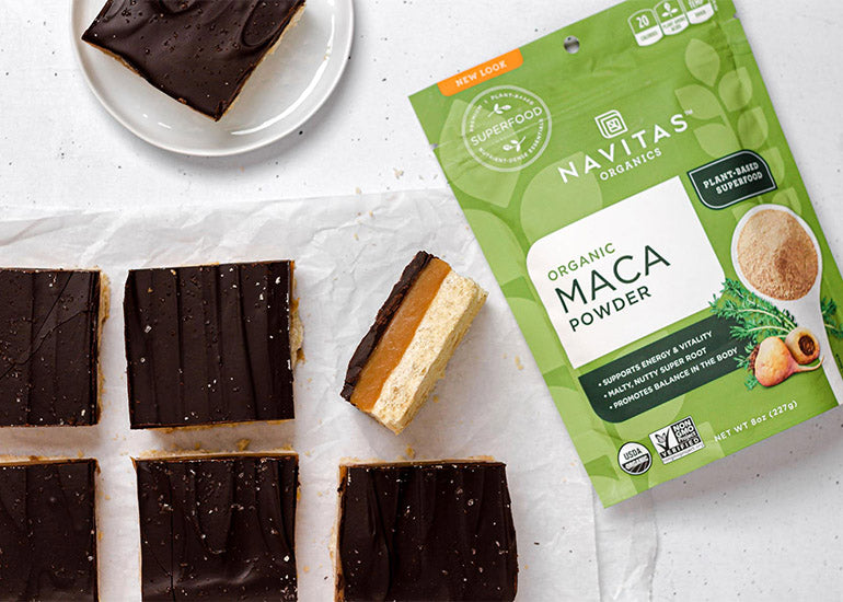 Rows of Millionaire's Shortbread Bars and a bag of Navitas Organics Maca Powder.