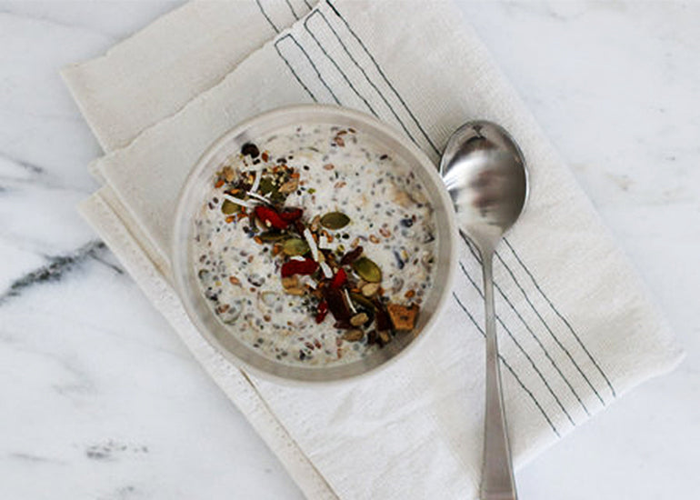 Bowl of gluten-free, paleo meusli made with seeds and dried fruit