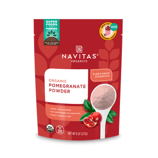 Package of Navitas Organics 8oz Pomegranate Powder featuring the product's branding, nutritional claims, and an illustration of pomegranates and a scoop of the powder.