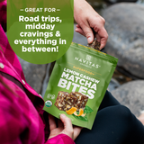 Navitas Organics Lemon Cashew Matcha Superfood+ Bites package held by a person outdoors.