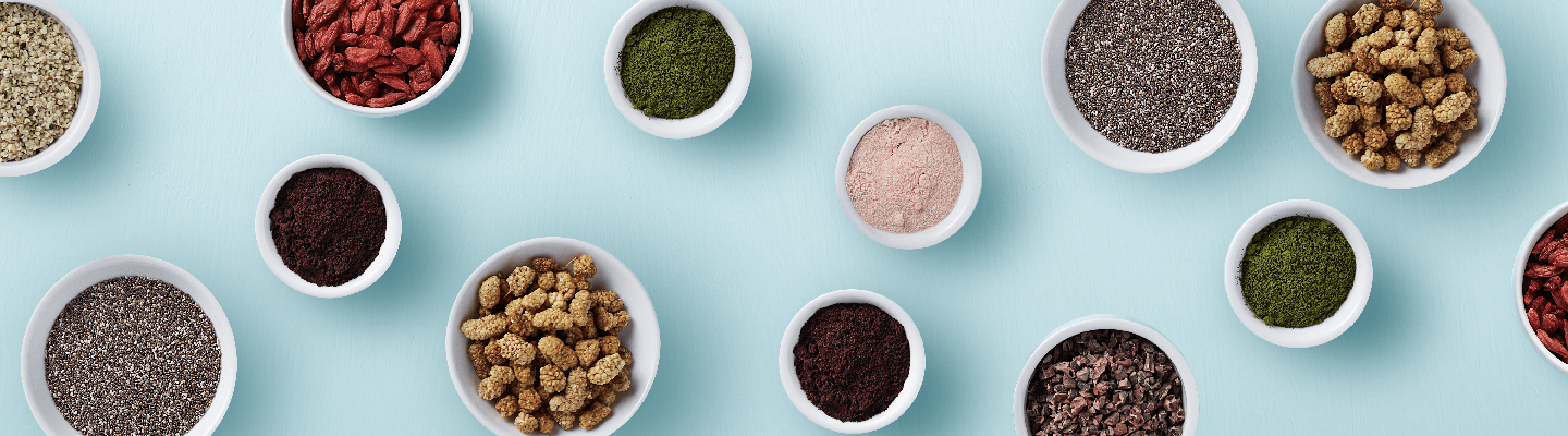 small white bowls with superfoods in each bowl