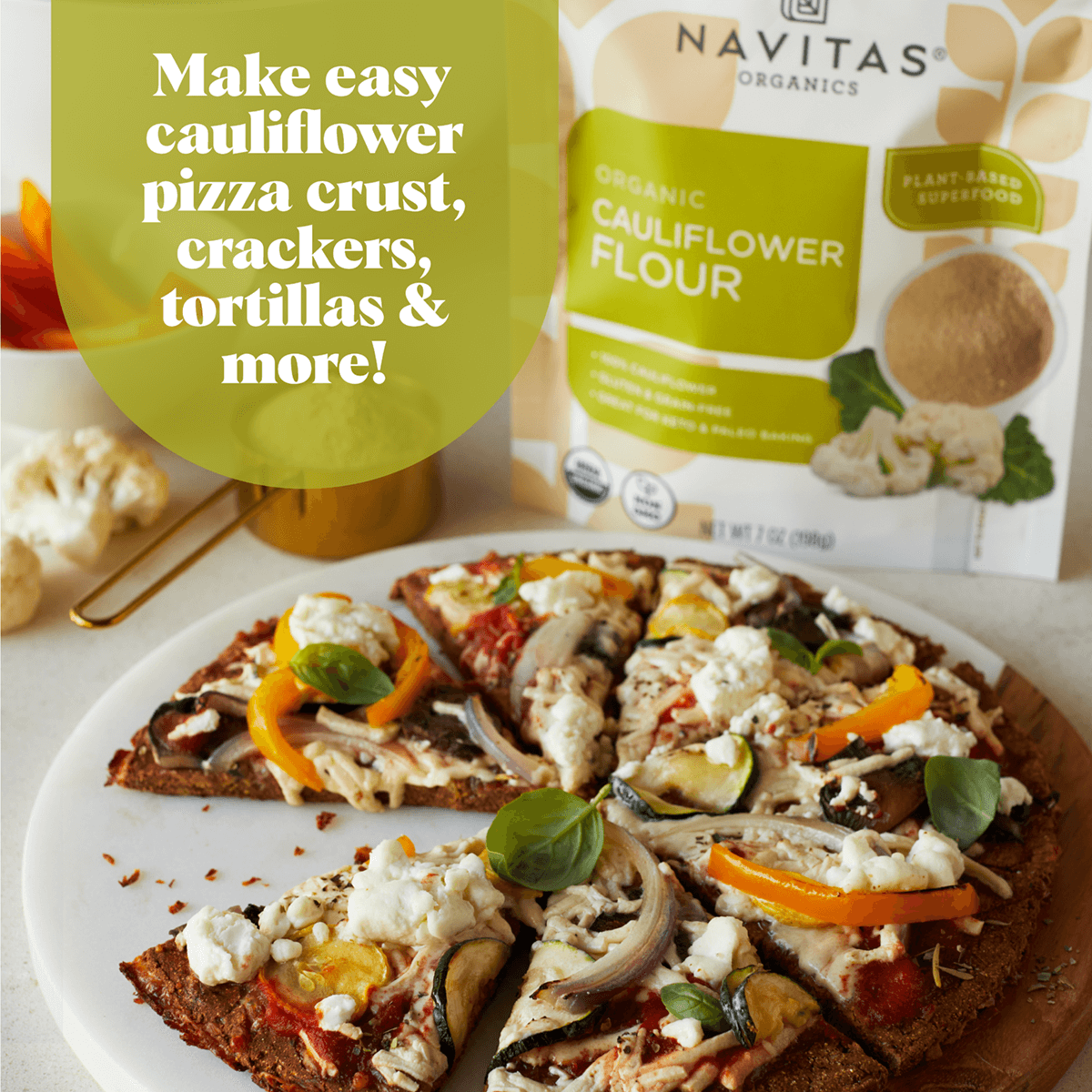 Navitas Cauliflower Flour. Make easy pizza crust, crackers, tortillas & more! Package of Cauliflower Flour next to a vege topped pizza.