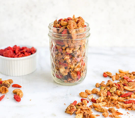 Ball jar with protein-packed almond granola made with Navitas Organics Goji Berries