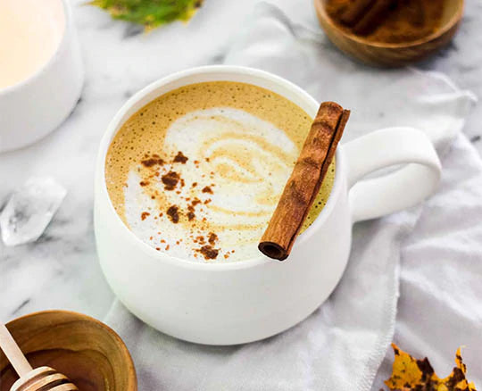 Cozy latte with cinnamon sprinkle made with Navitas Organics Turmeric Powder