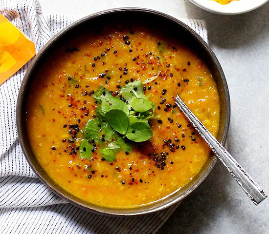 Bowl of turmeric lentil soup made with Navitas Organics Turmeric Powder