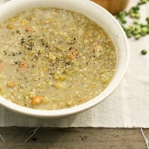 Bowl of vegan split pea soup topped with Navitas Organics Hemp Seeds