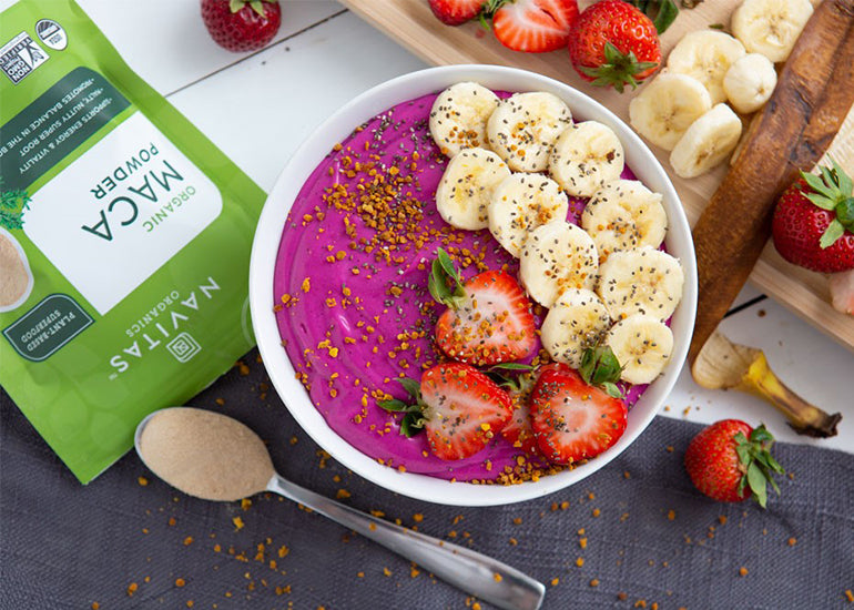A smoothie bowl made with Organic Dragon Fruit Smoothie Packs and Navitas Organics Maca Powder and Chia Seeds, topped with fresh fruit.