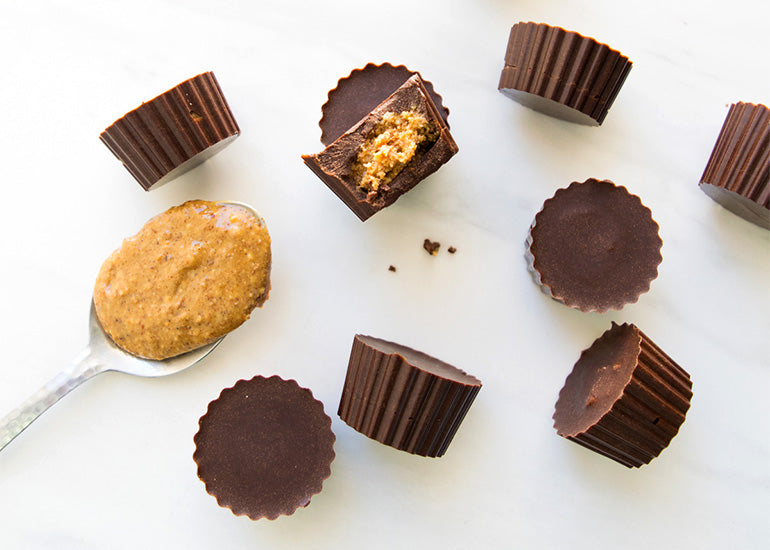 Almond butter chocolate cups made with Navitas Organics Cacao Powder and Cacao Butter.