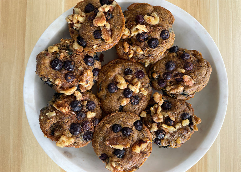 A bowl filled with blueberry walnut muffins made with Navitas Organics Chickpea Flour.