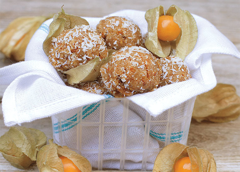 A basket filled with macaroons made with Navitas Organics Camu Powder and Goldenberries.