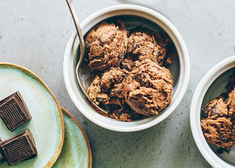 Chocolate peppermint edible cookie dough made with Navitas Organics Cacao Powder in bowls with spoons