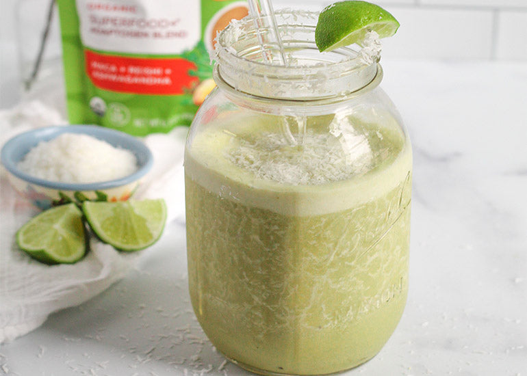 Mason jar filled with green smoothie made with Navitas Organics Matcha Powder and Superfood+ Adaptogen Blend