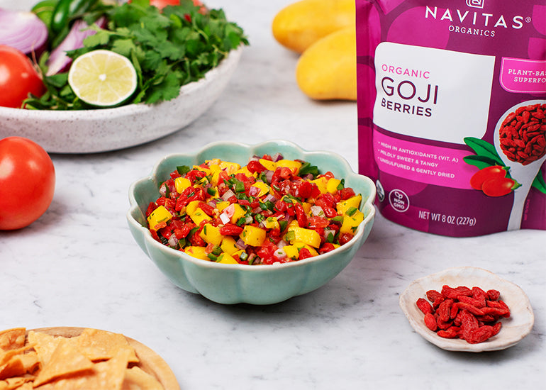 A dish filled with goji berry mango salsa made with Navitas Organics Goji Berries