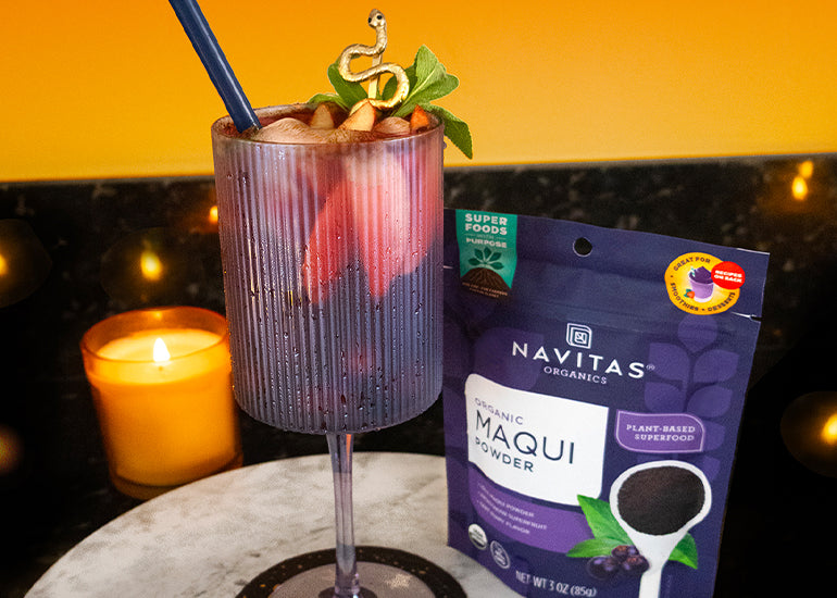 A tall glass filled with a fruity mocktail made with Navitas Organics Maqui Powder