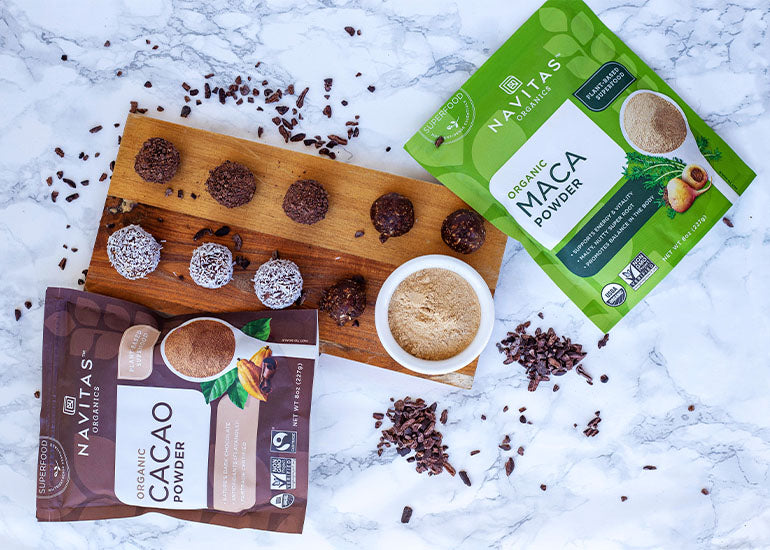 A cutting board topped with truffles made with Navitas Organics gelatinized Maca Powder and organic Cacao Powder