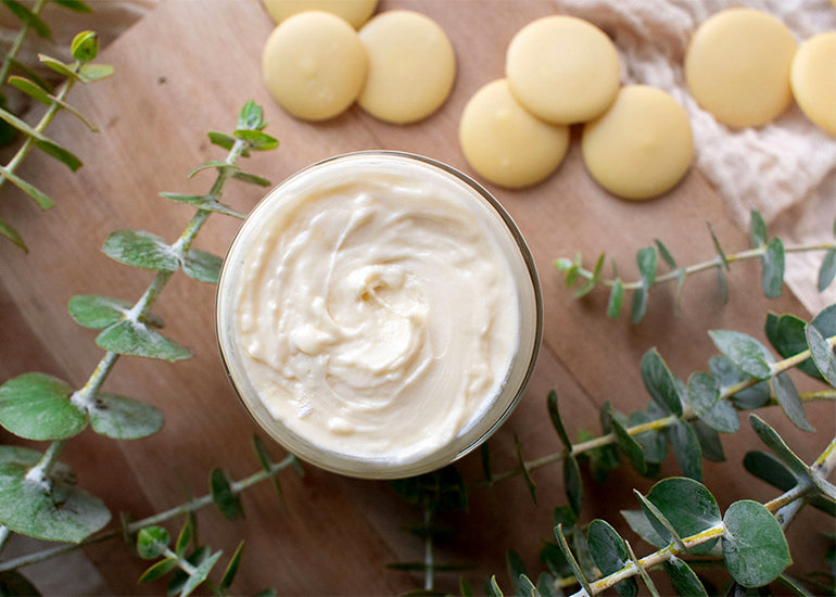 A counter topped with homemade body butter made with Navitas Organics cacao