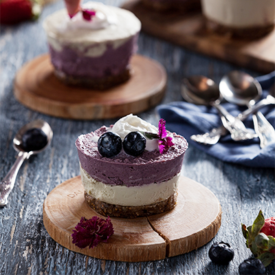 Blueberry Maqui Cheesecake made with Navitas Organics Cacao Powder, Cashew Nuts and Maqui Powder, topped with fresh blueberries and whipped cream