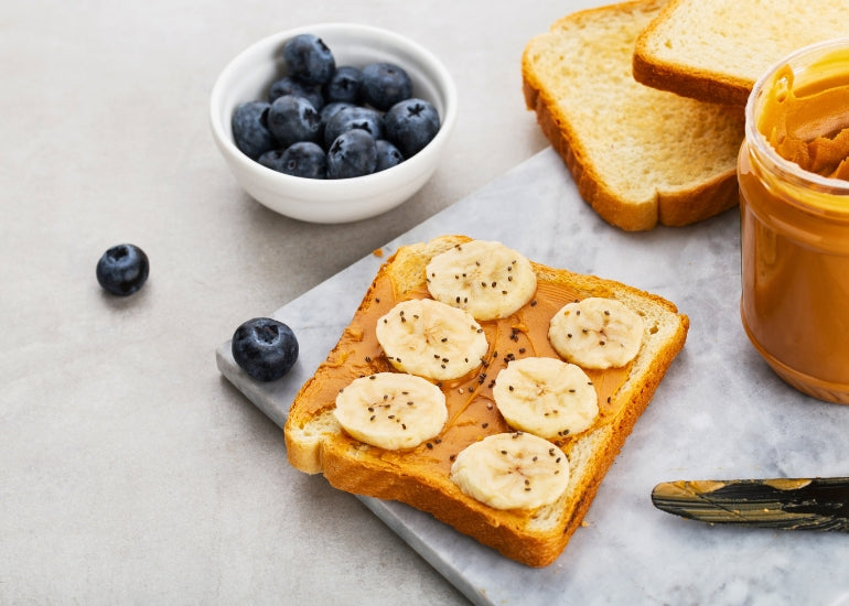 Peanut butter and banana toast topped with Navitas Organics Chia Seeds.